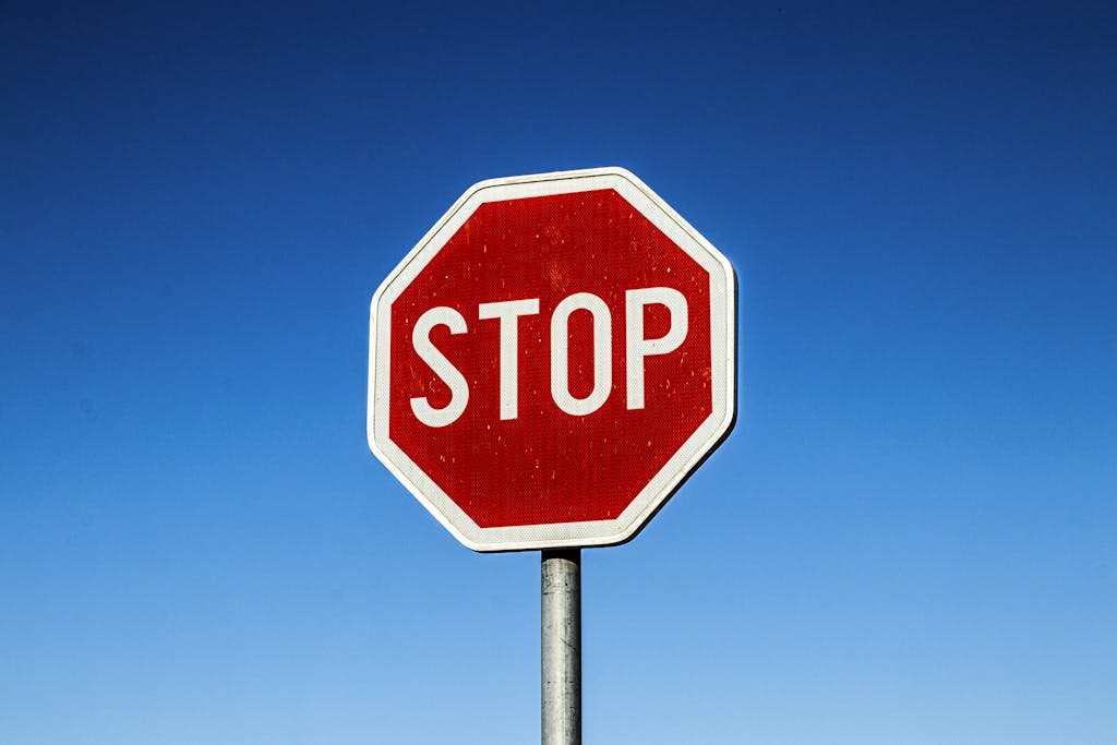 stop sign against a blue sky